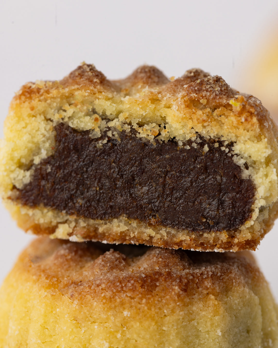 Close-up of Maamoul small tamer pastry filled with rich minced dates, traditional Middle Eastern sweet treat.